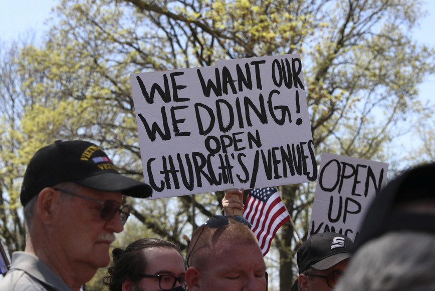 Protesters outside the Statehouse in Topeka demanded last month that Gov. Laura Kelly let businesses and activities return to normal. Nomin Ujiyediin / Kansas News Service