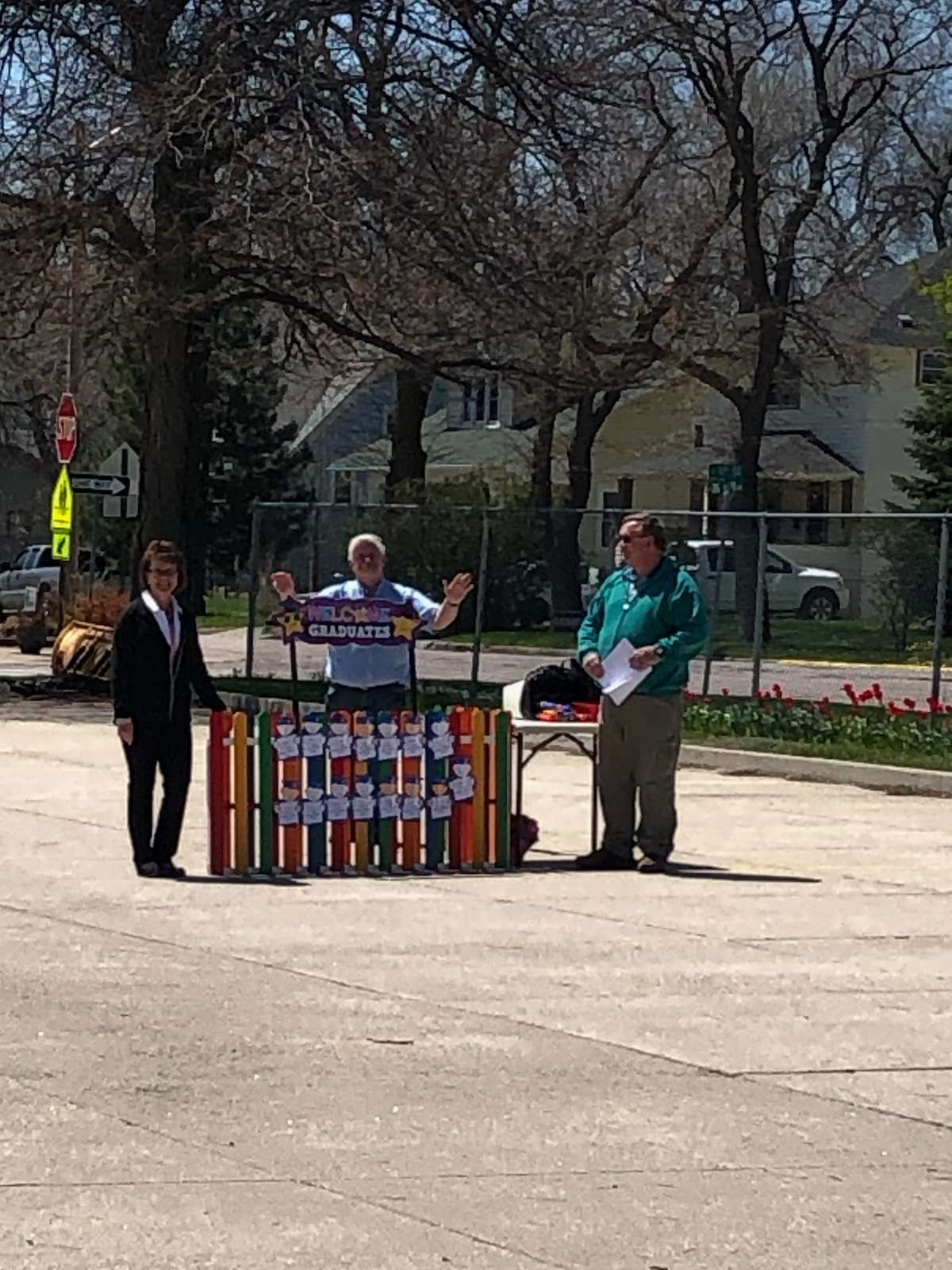 Mrs. Martinez, Mr. Wilhelm, and Fr. Tim giving his blessing before this unique graduation ceremony.&nbsp;