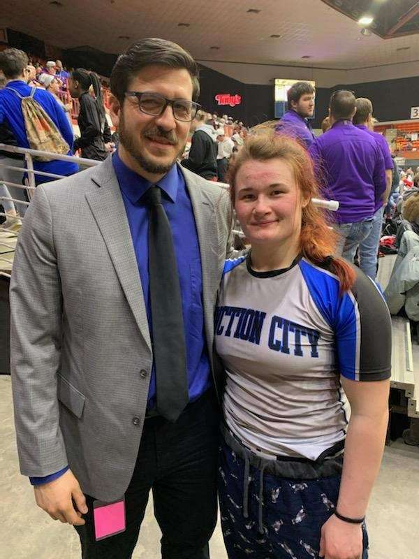 ( L-R ) JCHS wrestling coach Tyler Gonzalez and Elisa Robinson after Elisa won a state wrestling title in the first ever season that girls wrestling was sanctioned by the Kansas State High School Activities Association. Earlier in her high school career she won three other ( unofficial ) state wrestling tournaments.