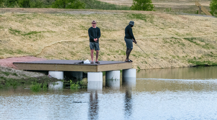 Fishermen cast from one of the new angler access features at the lower Ice House Pond.&nbsp;(Nebraskaland/Justin Haag)