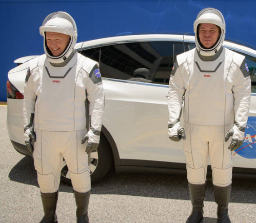 <i>NASA astronauts Douglas Hurley, left, and Robert Behnken, wearing SpaceX spacesuits, are seen as they depart the Neil A. Armstrong Operations and Checkout Building for Launch Complex 39A during a dress rehearsal prior to the Demo-2 mission launch, Saturday. Credits: NASA/ Bill Ingalls</i>