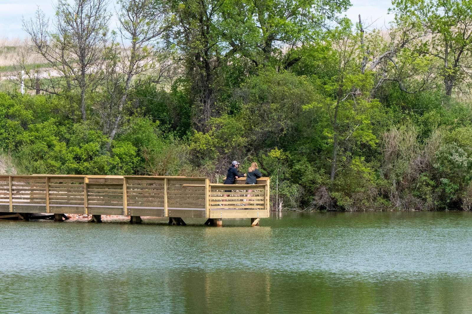 Memorial Day park visitors enjoy the view from the new pier at Cherry Creek Pond. (Nebraskaland/Justin Haag)