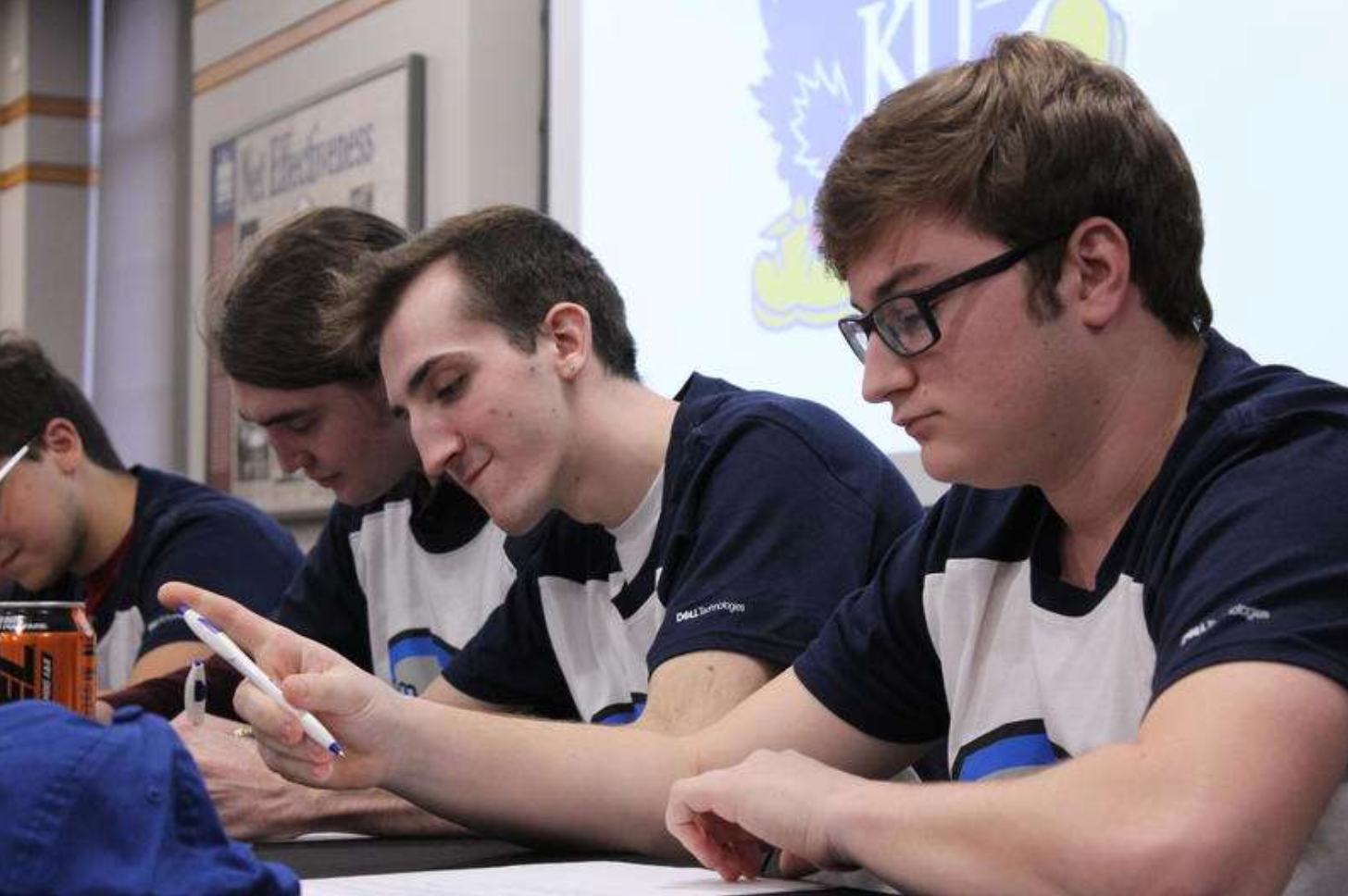Six KU students sign contracts to join the university's varsity esports team. Stephan Bisaha / Kansas News Service