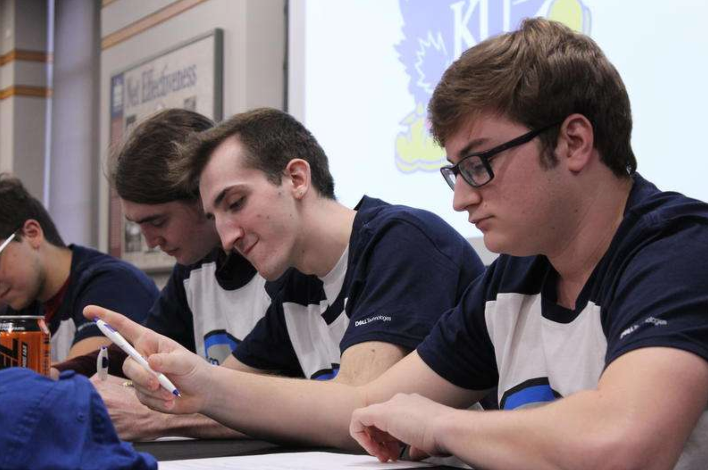 Six KU students sign contracts to join the university's varsity esports team.  Stephan Bisaha / Kansas News Service 