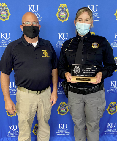 Class president Deputy Lauren Tucker of the Rooks County Sheriff’s Office with KLETC Executive Director Darin Beck. KLETC photo