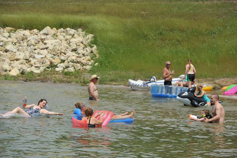 <b>Even during fun times at the lake, when the heat is on, make sure stay hydrated.</b> Photo courtesy Kansas Tourism