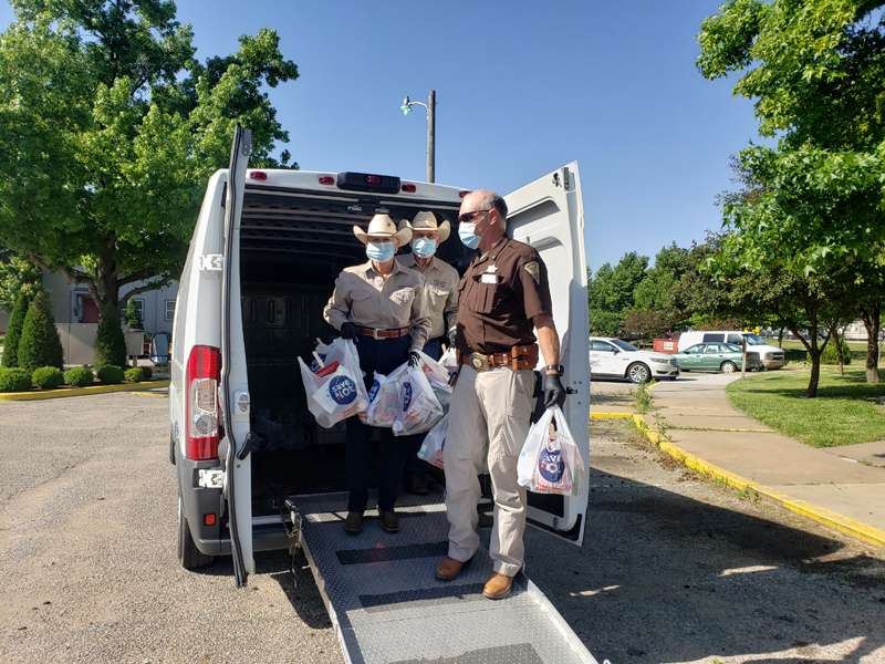 <b>Members of the Saline County Sheriff's Mounted Patrol &amp; Rescue Squad prepare to deliver&nbsp;essential supply kits on Saturday.</b> Photo courtesy MPRS