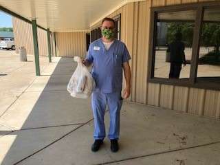<b>Andy Sutter, RN, and Executive Director of Village Manor in Abilene.  He is smiling through the face mask.</b> Photo courtesy OCCK