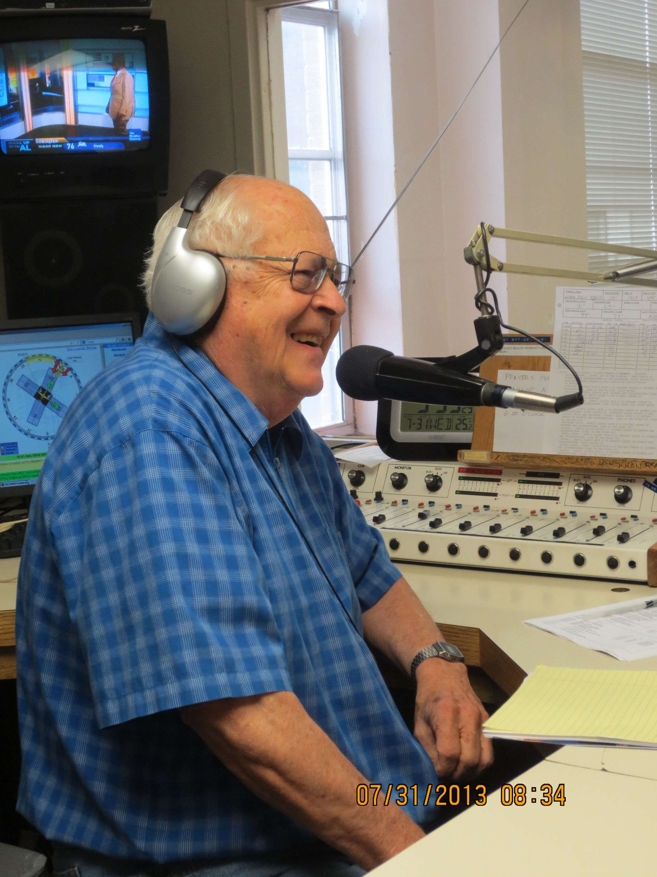 Longtime Phillipsburg radio personality Tad Felts laughs as he interviews a rodeo guest. Felts has attended the rodeo nearly every year since he and his wife Patt moved to Phillipsburg more than fifty years