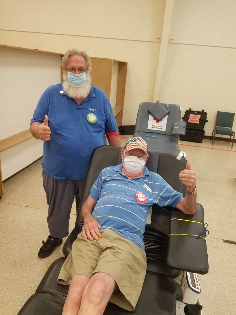 <b>Eagle Radio's Sam Pridey and Dave Foor encourage Salinans to PUMP Up the Volume at the blood drive on Monday.&nbsp;</b>