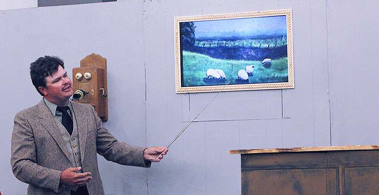 &nbsp;Jerrett Leiker as Einstein analyses a painting during HCT's&nbsp;"Picasso at the Lapin Agile."
