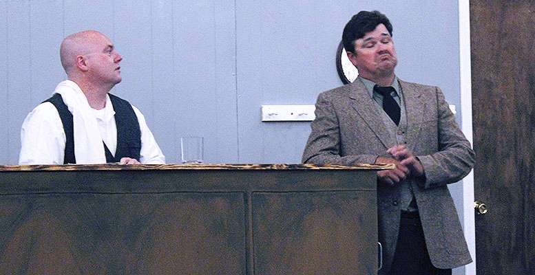 Jerrett Leiker as Einstein talks to bartender William R. Brown as Freddy in "Picasso at the Lapin Agile."