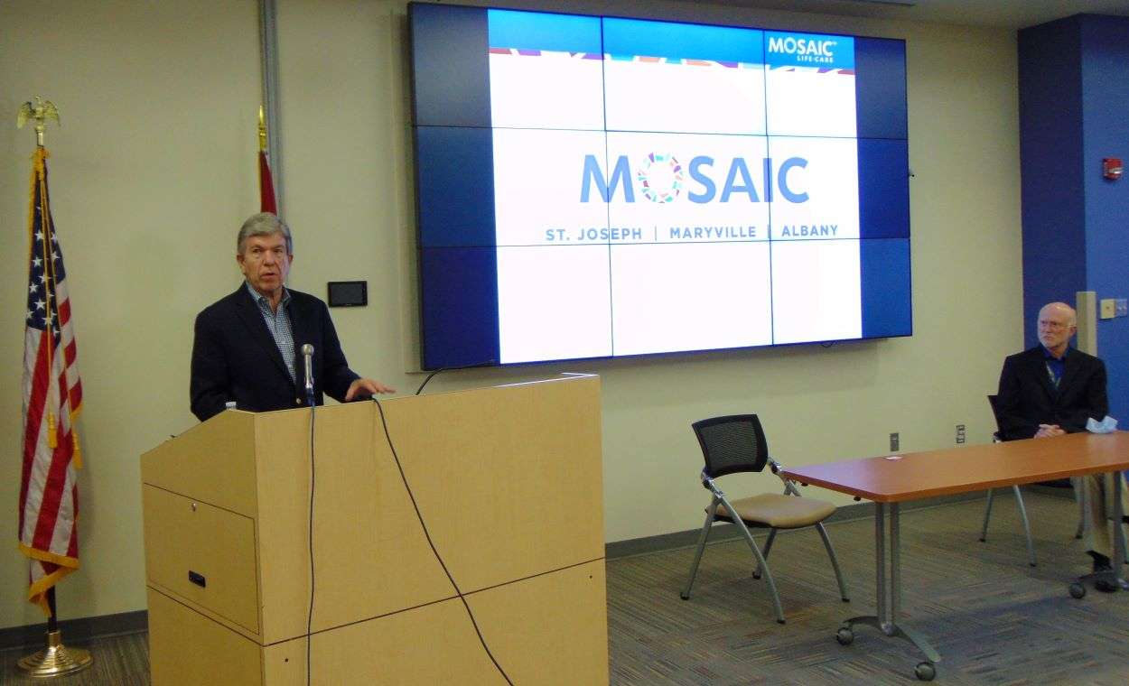 Sen. Roy Blunt speaks with reporters as Mosaic Life Care DEO, Dr. Mark Laney, looks on/Photo by Brent Martin