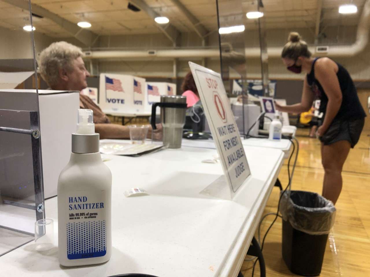 An Ellis County voter submits her identification to a poll worker at the Hays Recreation Center Tuesday morning prior to receiving her ballot. (Photos by Becky Kiser)