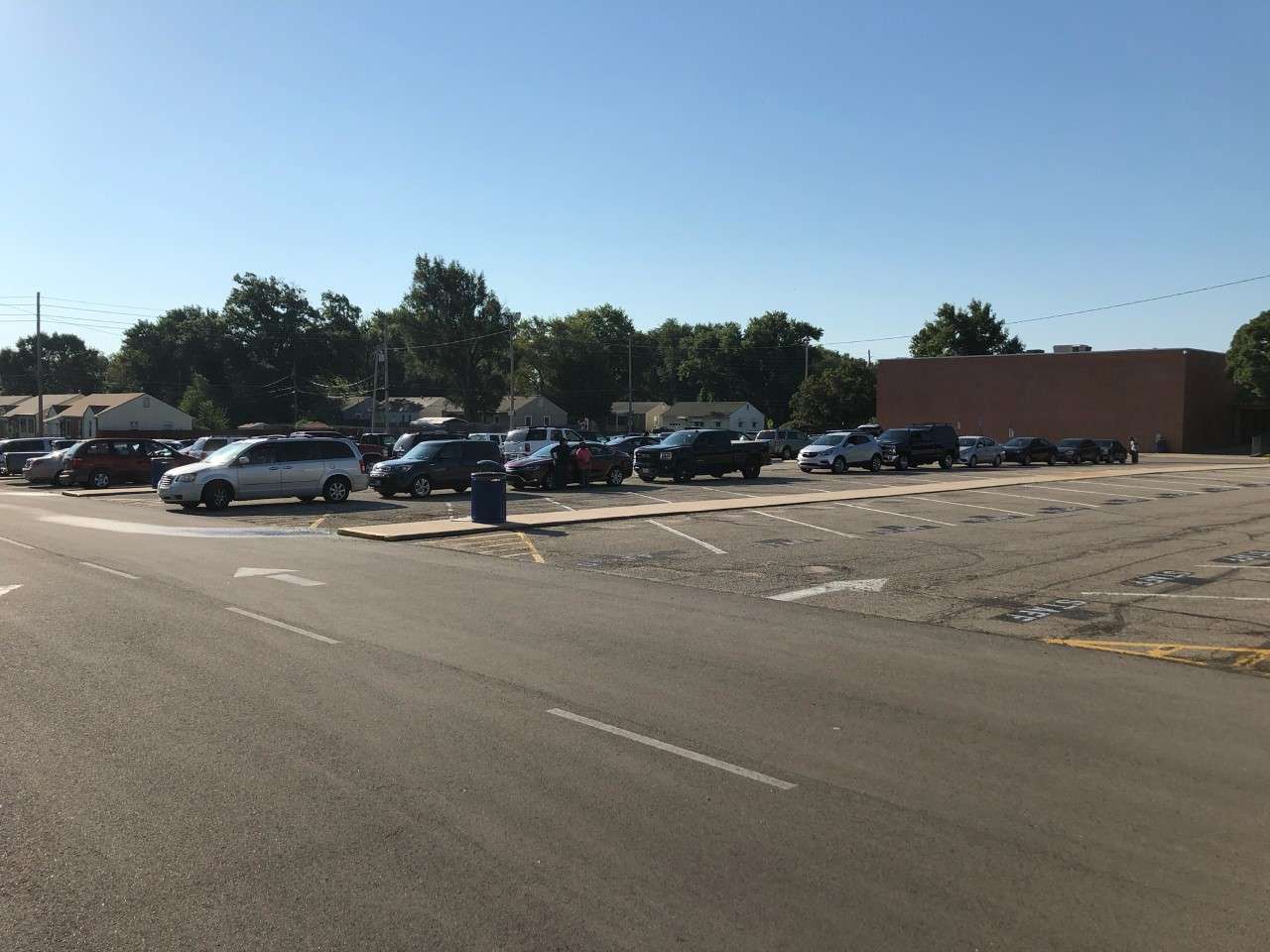 Motorists waiting to pick up free produce and dairy items