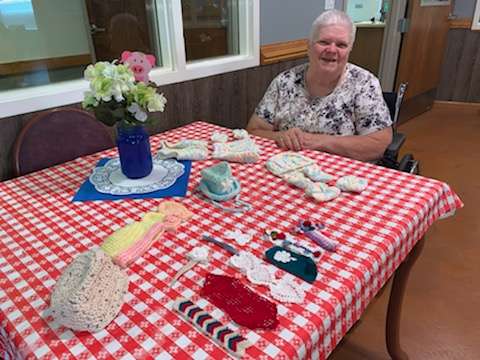 Frankie Ream sits near some crocheted items that are part of the craft fair. Courtesy photo