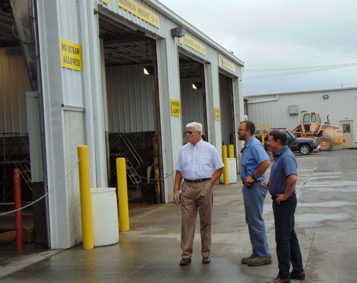 Deluxe Truck Stop owner Bob Wollenman and his son, Nick, give Congressman Graves a tour of the facility./Photo by Brent Martin