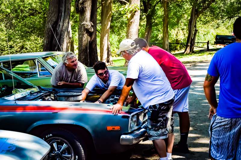 A group of Thunder on the Plains attendees talking during the 2019 show.