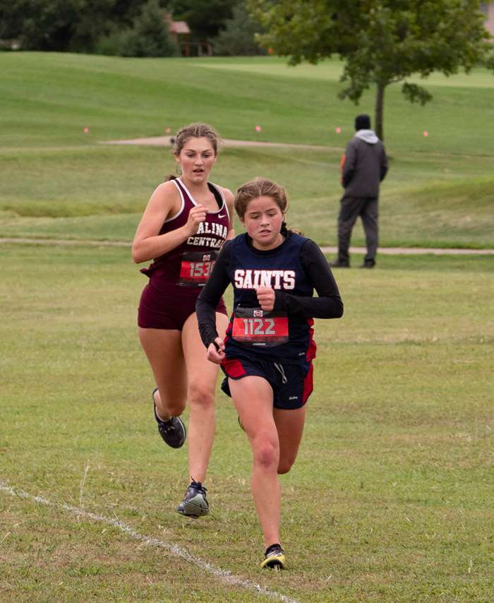 <b>Salina Central's Cora White, left, runs at the Hesston Swather Special Thursday.</b> Photo courtesy Danton McDiffett