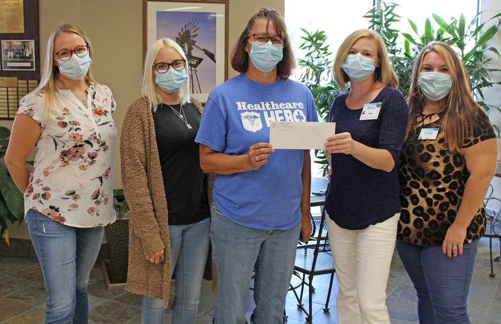 <i><b>Pictured from left are:&nbsp; Traci Jurgensen, EOC committee member, Michaela Howser, MHS employee; Murphy; Haley Jones, EOC committee member; and Cindy Whittington, EOC committee member.</b> Photo courtesy MHS</i>