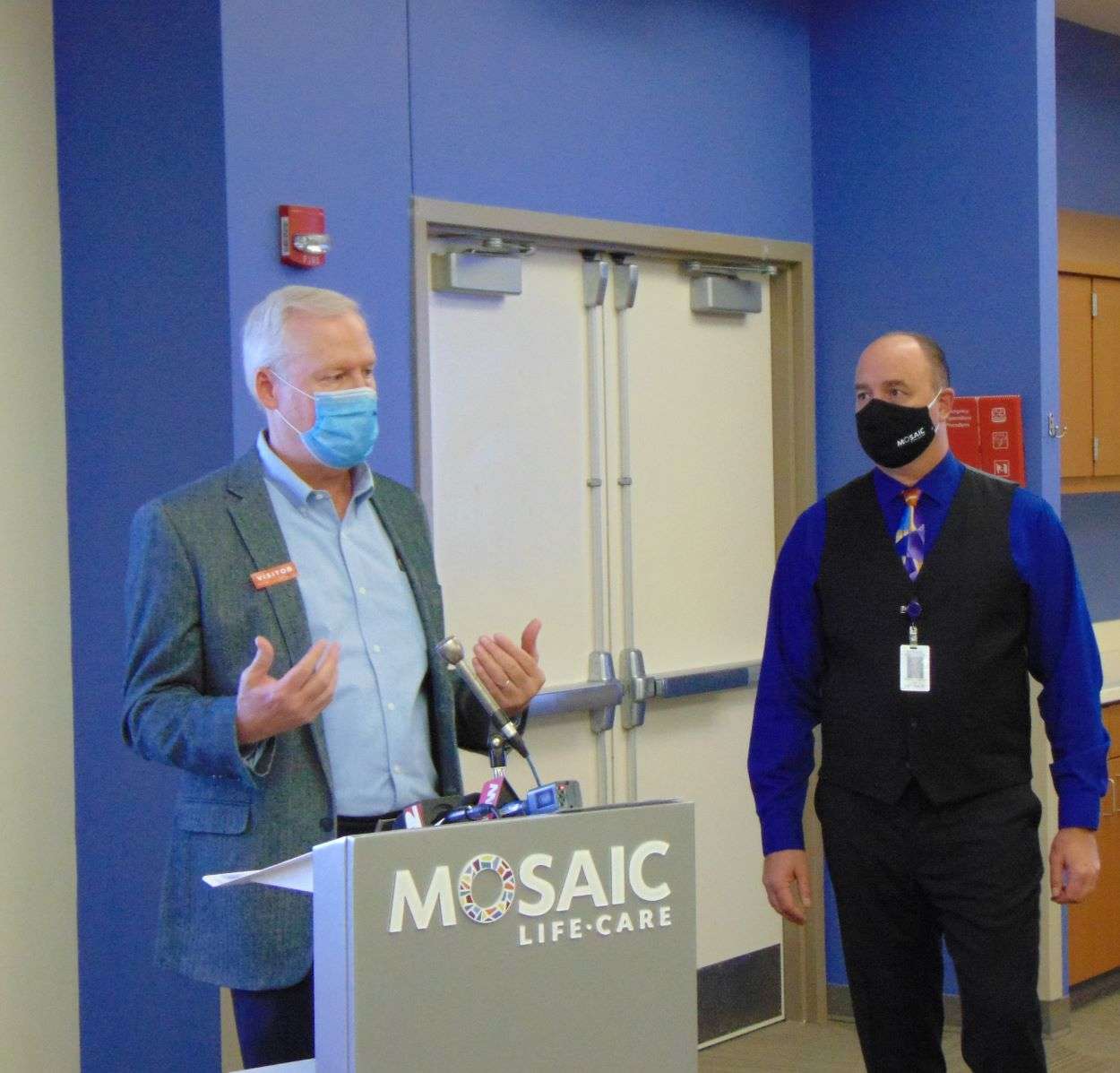 Buchanan County Presiding Commissioner Lee Sawyer speaks during a news conference as Mosaic Life Care Chief Quality Officer, Dr. Edward Kammerer, looks on./Photo by Brent Martin