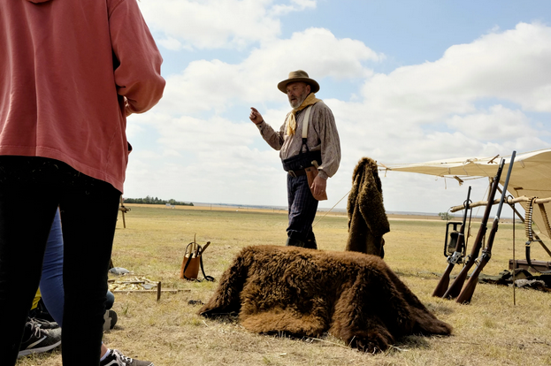 Rich Walter demonstrates knife sharpening and buffalo hides at an annual event by the Wallace County’s museum. It was held outside due to the pandemic.