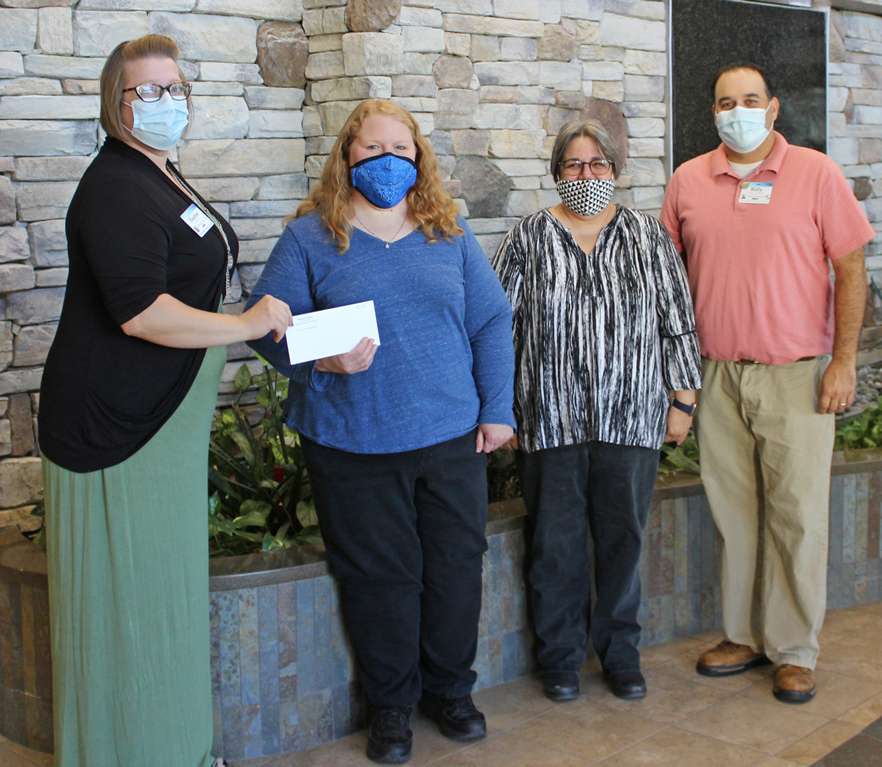 <i><b>Pictured from left are: Heather Bohannan, EOC committee member; Shayla Mohr, Abilene Deputy City Clerk; Karla Efurd, Abilene Deputy Finance Director; and Billy Hansen, EOC committee member. </b>Photo courtesy MHS</i>