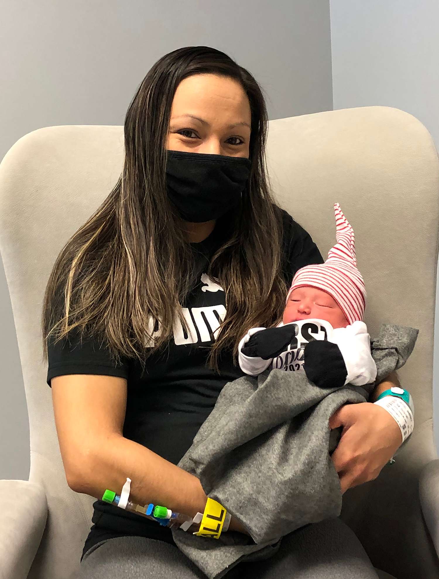 Dakotah Weitzel holds son Zyaire, Regional West’s first baby of 2021.