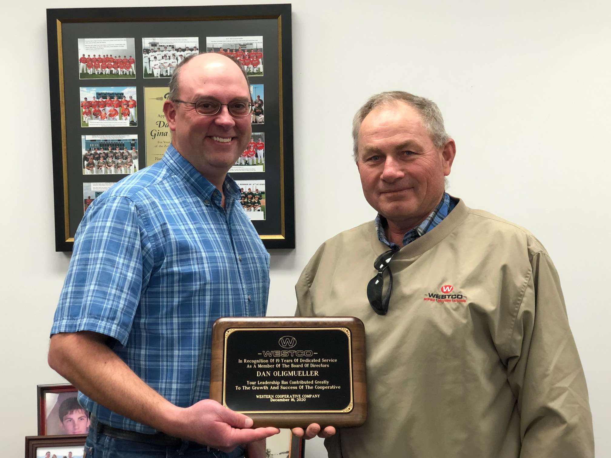 WESTCO Board of Directors Chairman Erik Peterson (left), presents Dan Oligmueller with a plaque in honor of Oligmueller’s completion of 19 years of service to the board.