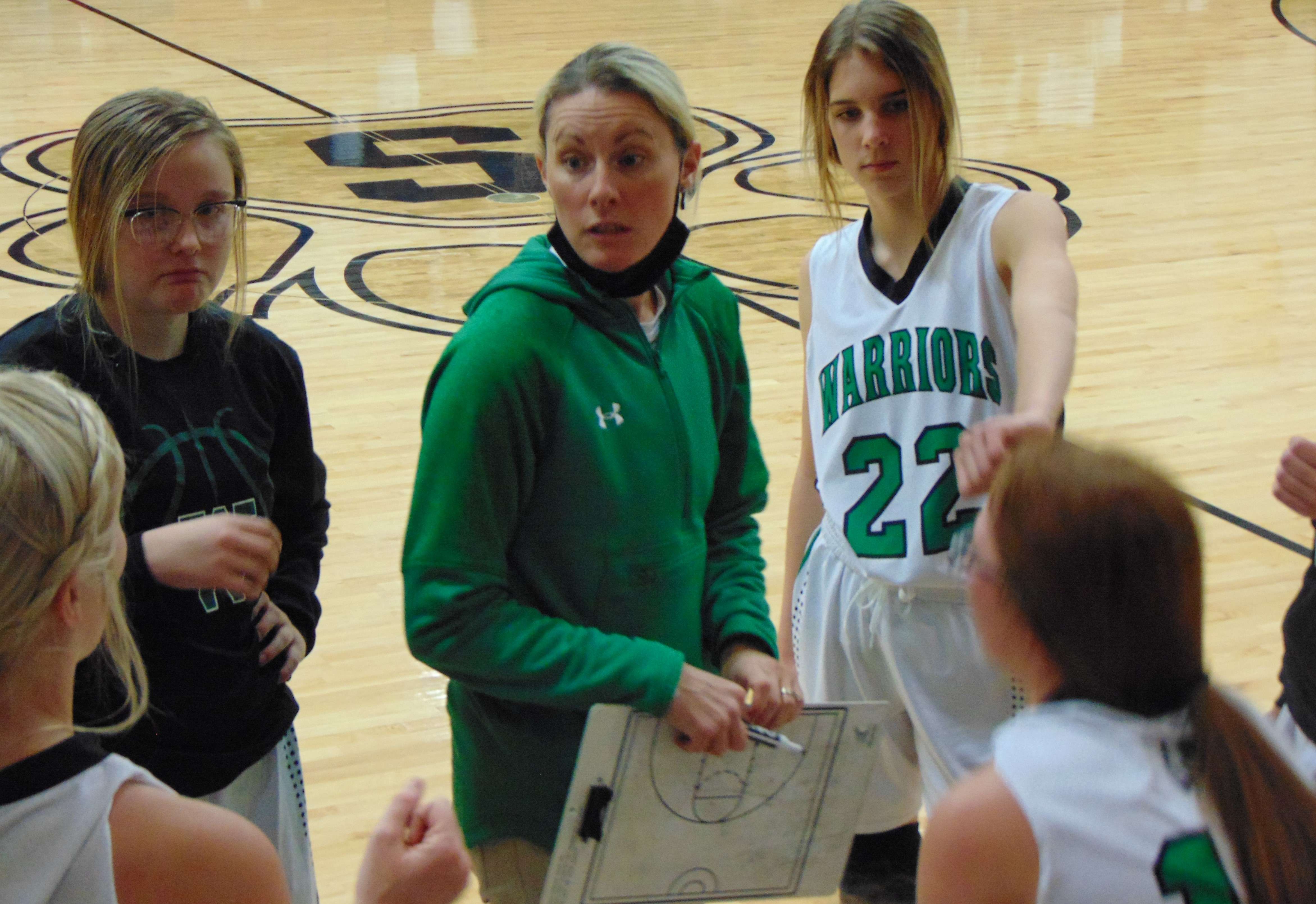 Albany girls' basketball coach Brooke Crawford talks to her team during a timeout in Mondays' 49-44 win over North Andrew in the Stanberry Invitational. Photo by Tommy Rezac.