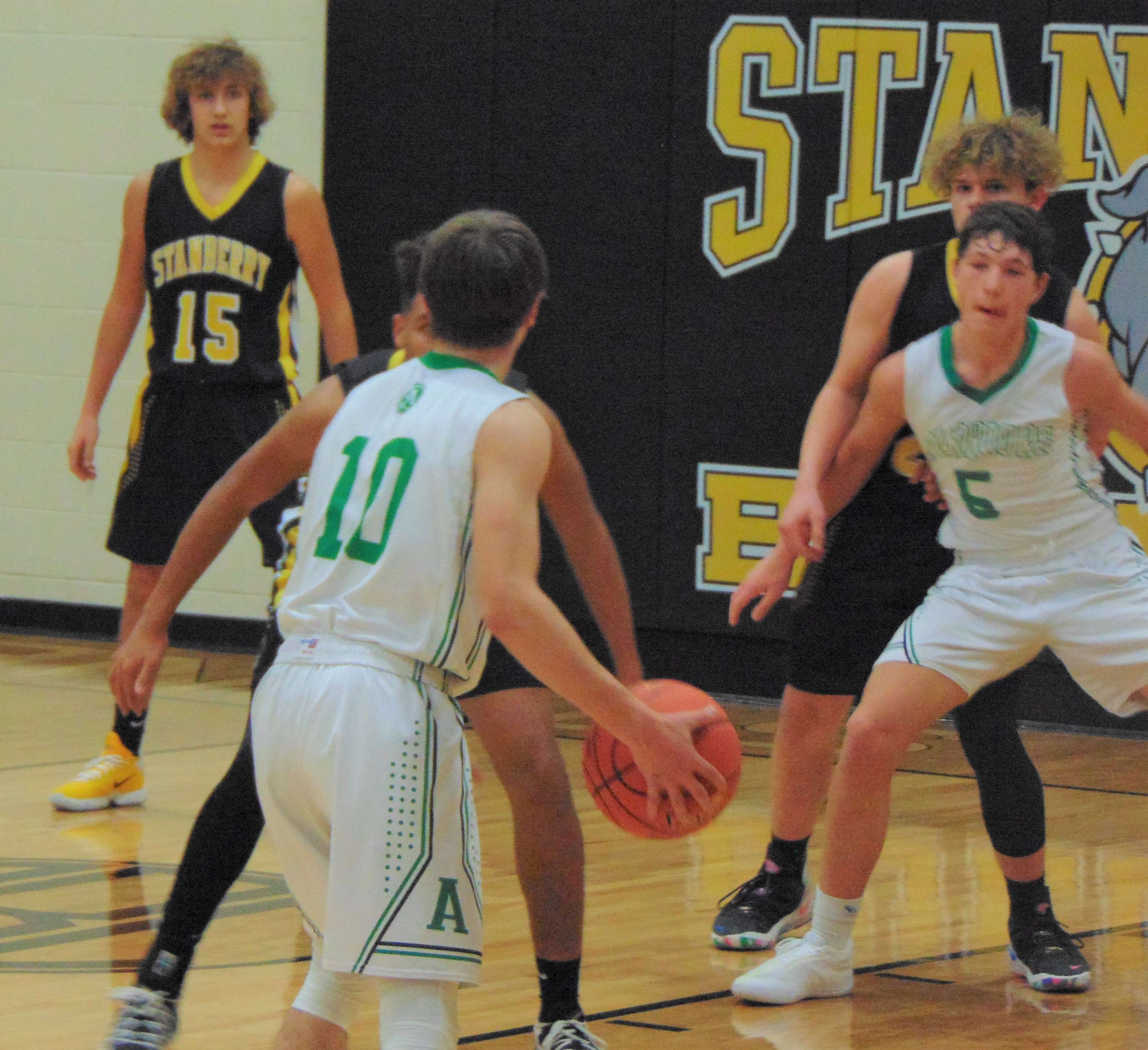 Albany's Kaeden Hutchinson (10) brings the ball up the floor in the second half, as the Warriors fell to Stanberry 49-30 on Monday night in the Stanberry Invite. Photo by Tommy Rezac.