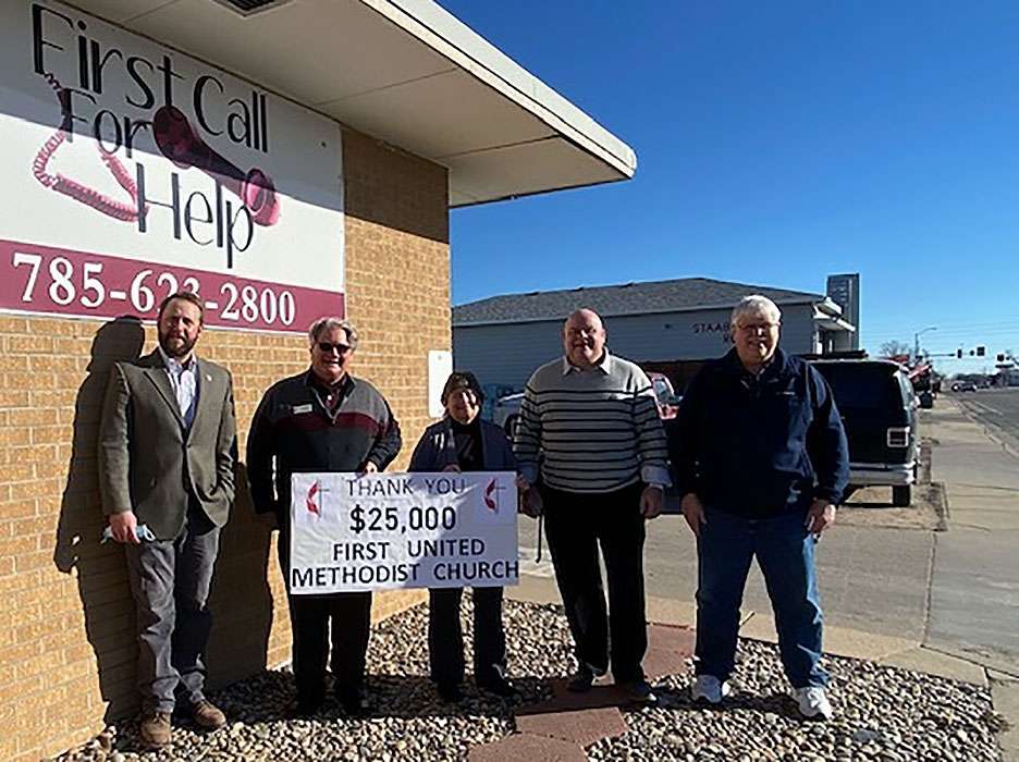 (Not in order) Representatives from the Hays First United Methodist Church Senior Pastor Mike Rose, Troy Miller, and FUMC Endowment Chairman Greg Doughhetee, along with Hale Sloan representing Hays Noon Rotary present funds to Linda Mills, First Call for Help executive director, for the First Step Housing project.