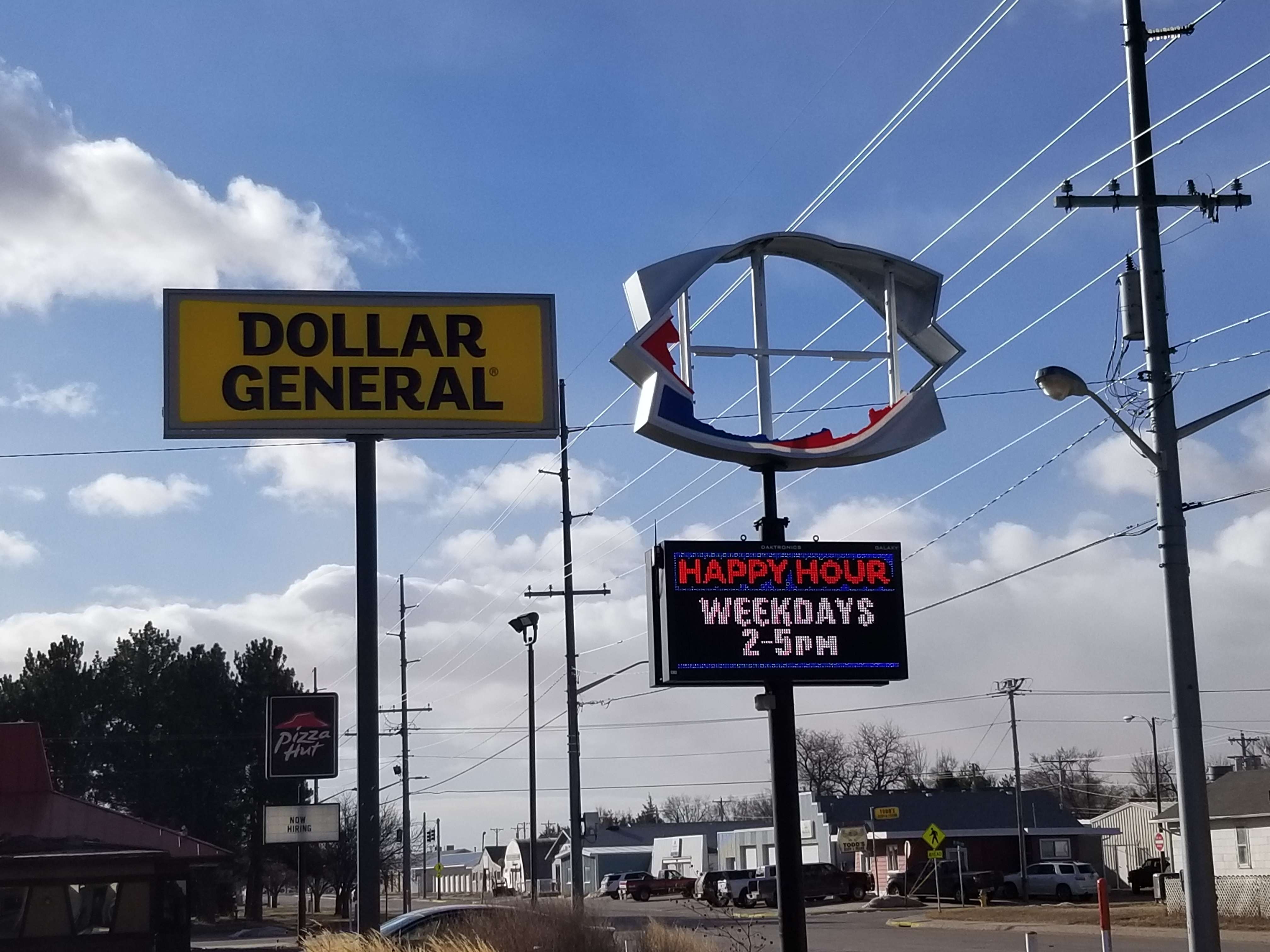 Dairy Queen's sign completely destroyed by wind gusts. In the far left corner of this photo is the old Pizza Hut building, which had roof damage.&nbsp;