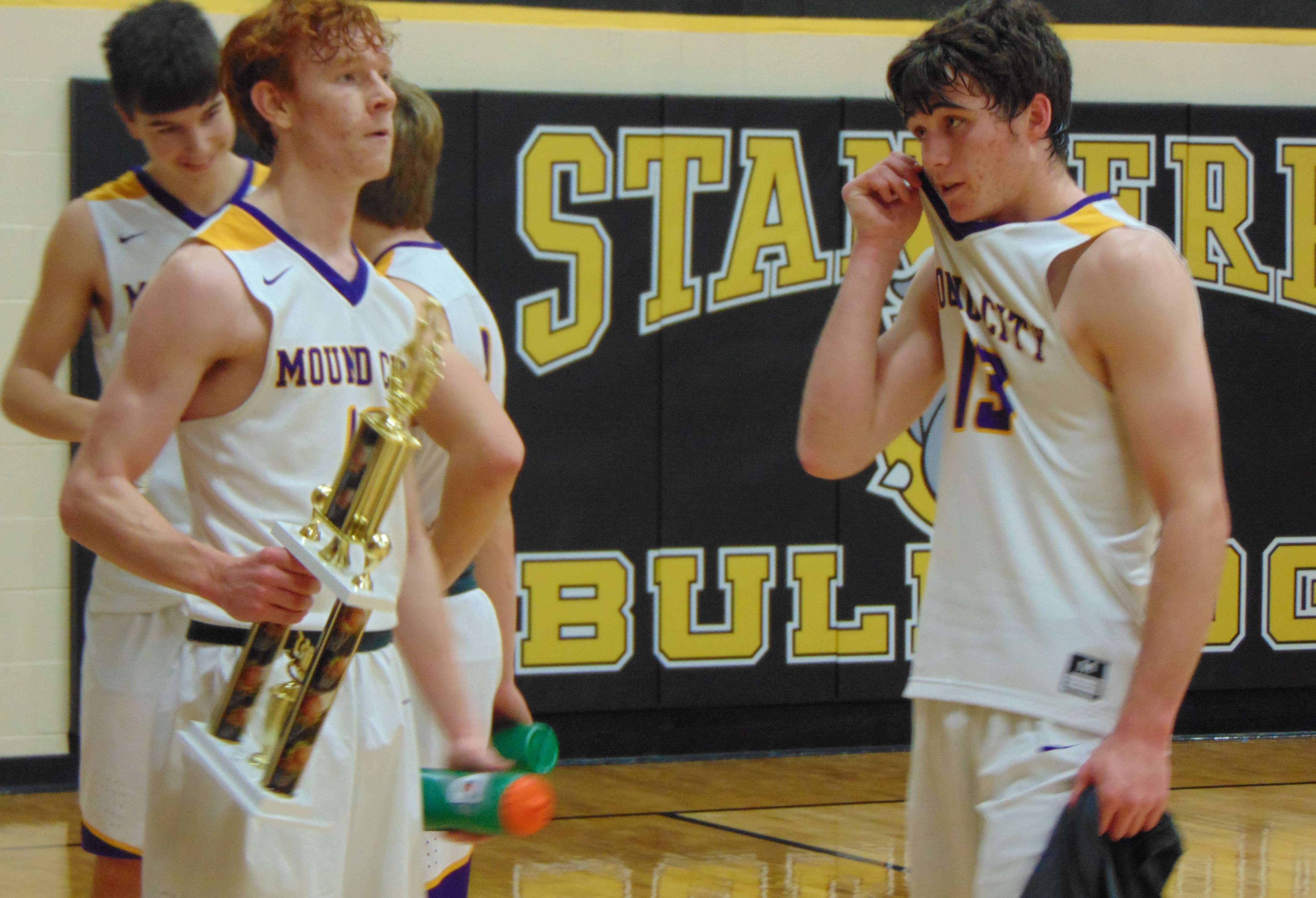 Mound City senior Gage Salsbury holds the Stanberry Invitational Championship trophy after the Panthers' 71-49 win over North Andrew Saturday. Photo by Tommy Rezac.