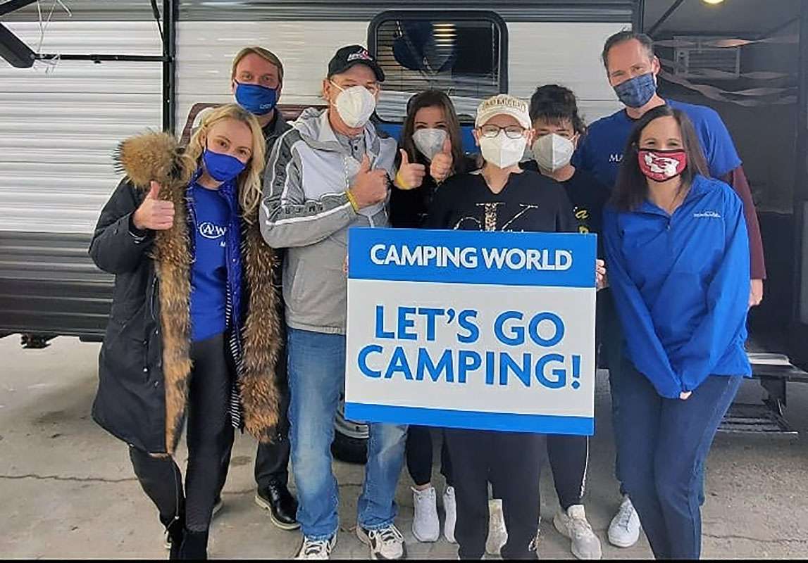 Sophia Linenberger, front row center, with her family father Stan Linenberger, mother Jenny Linenberger, sister Holly Linenberger and those who made her Make A Wish possible, including James McDonald, Kansas City Camper World general manger, Mark and Felisha McDougald and Kelly of Make A Wish. Sophia of Hays received a camper from Camper World in Kansas City, Kan. Courtesy photos