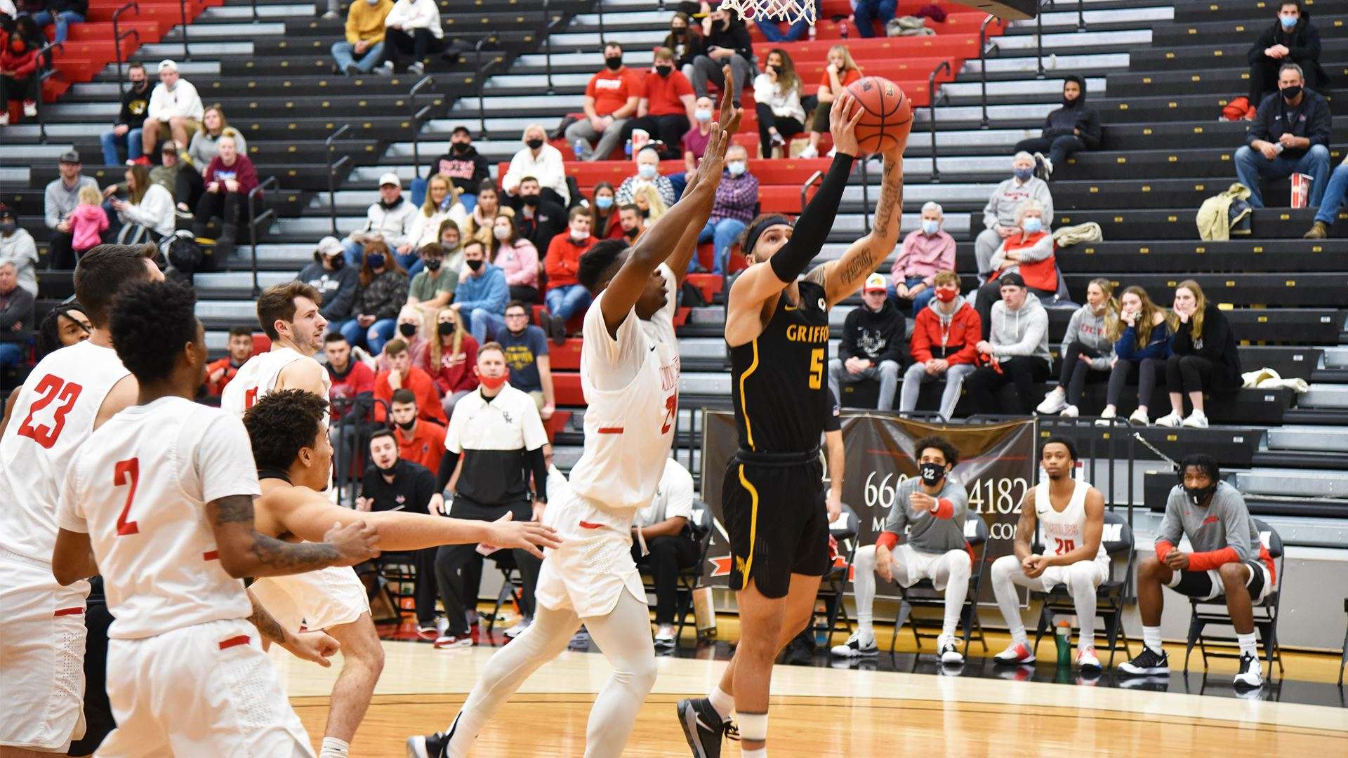 Caleb Bennett (5) goes up for a shot in Thursday's loss at Central Missouri. Photo via GoGriffons.com.