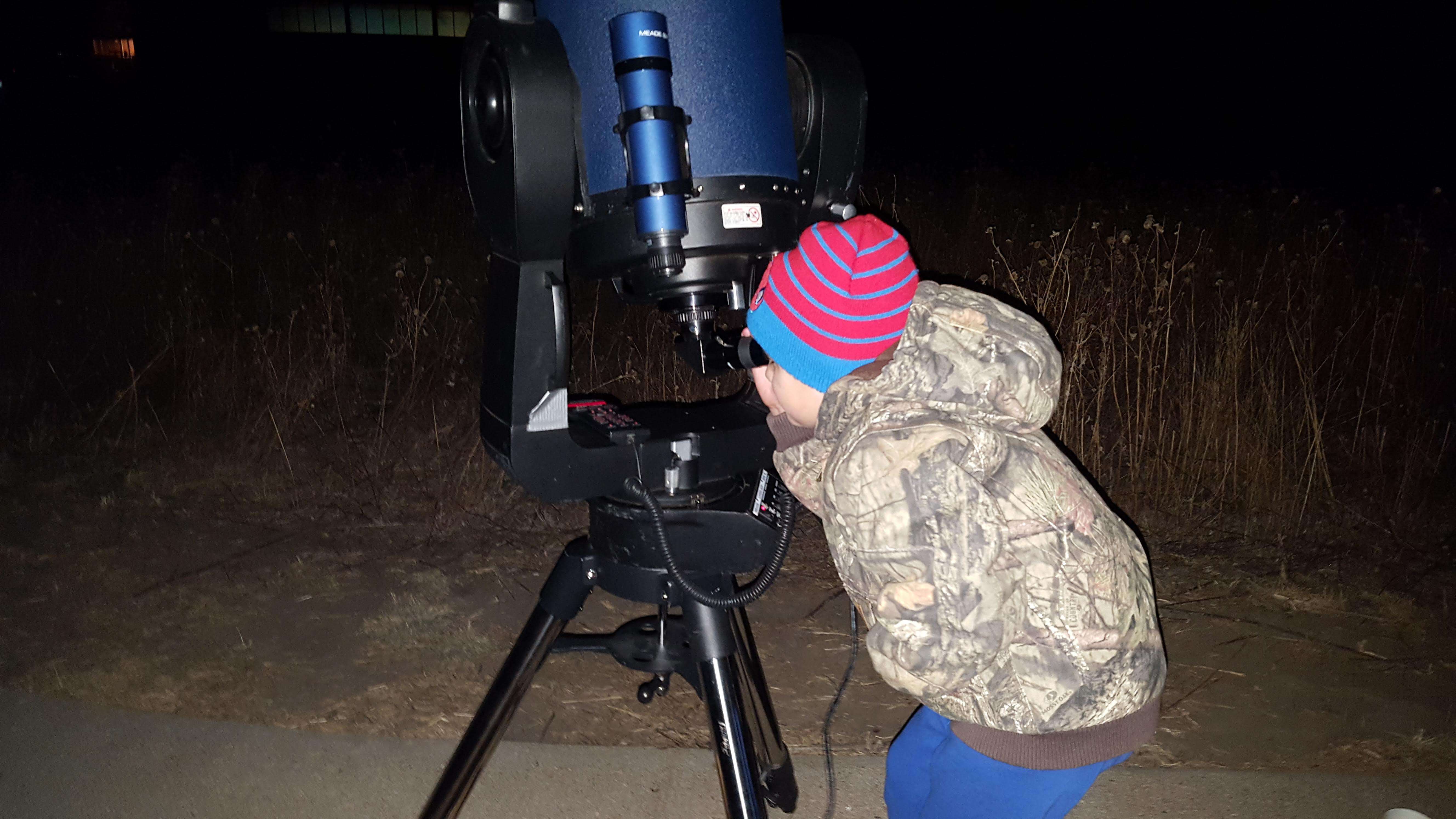 A child views deep-sky Messier Objects at a previous star gazing workshop at the Kansas Wetlands Education Center.