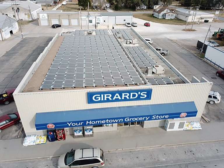 John Girard, owner, Girard's IGA, installed solar panels on his store's roof in 2020 to reduce his electricity costs. Courtesy photo<br>