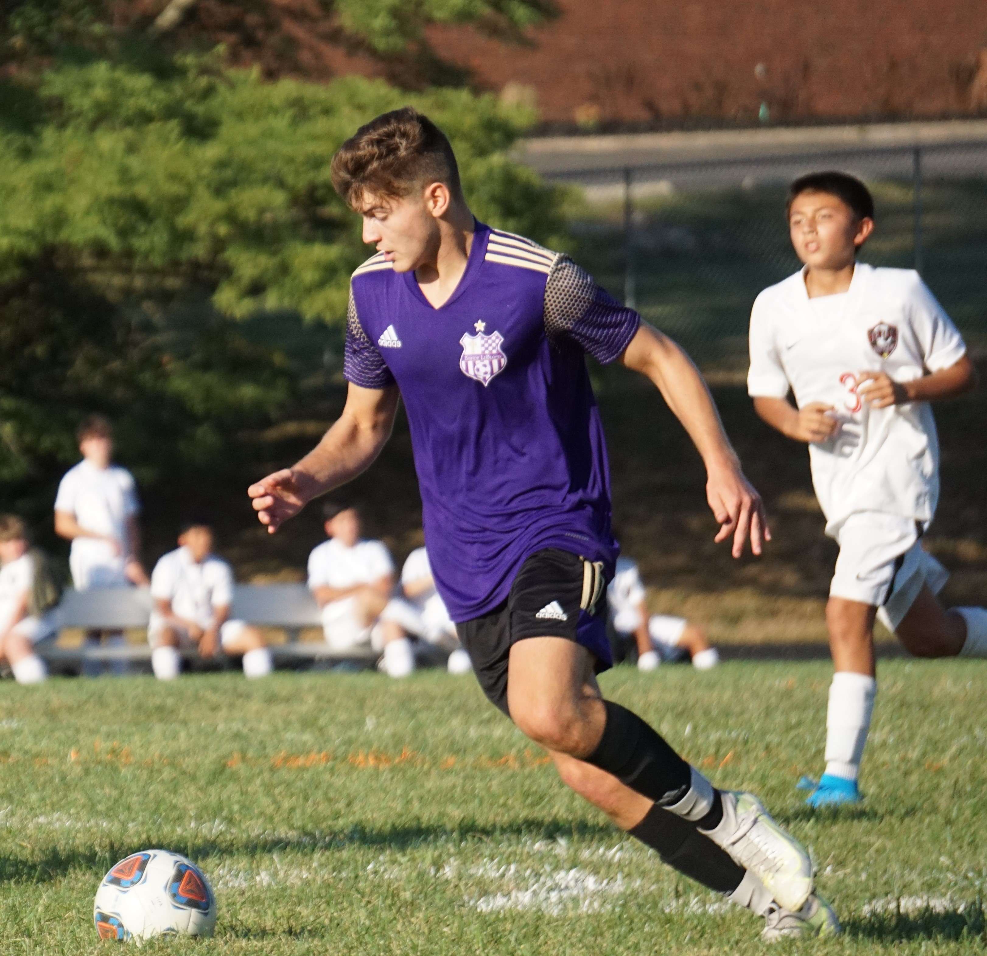 Adan Seiter dribbles in the first half. Photo by Tommy Rezac.