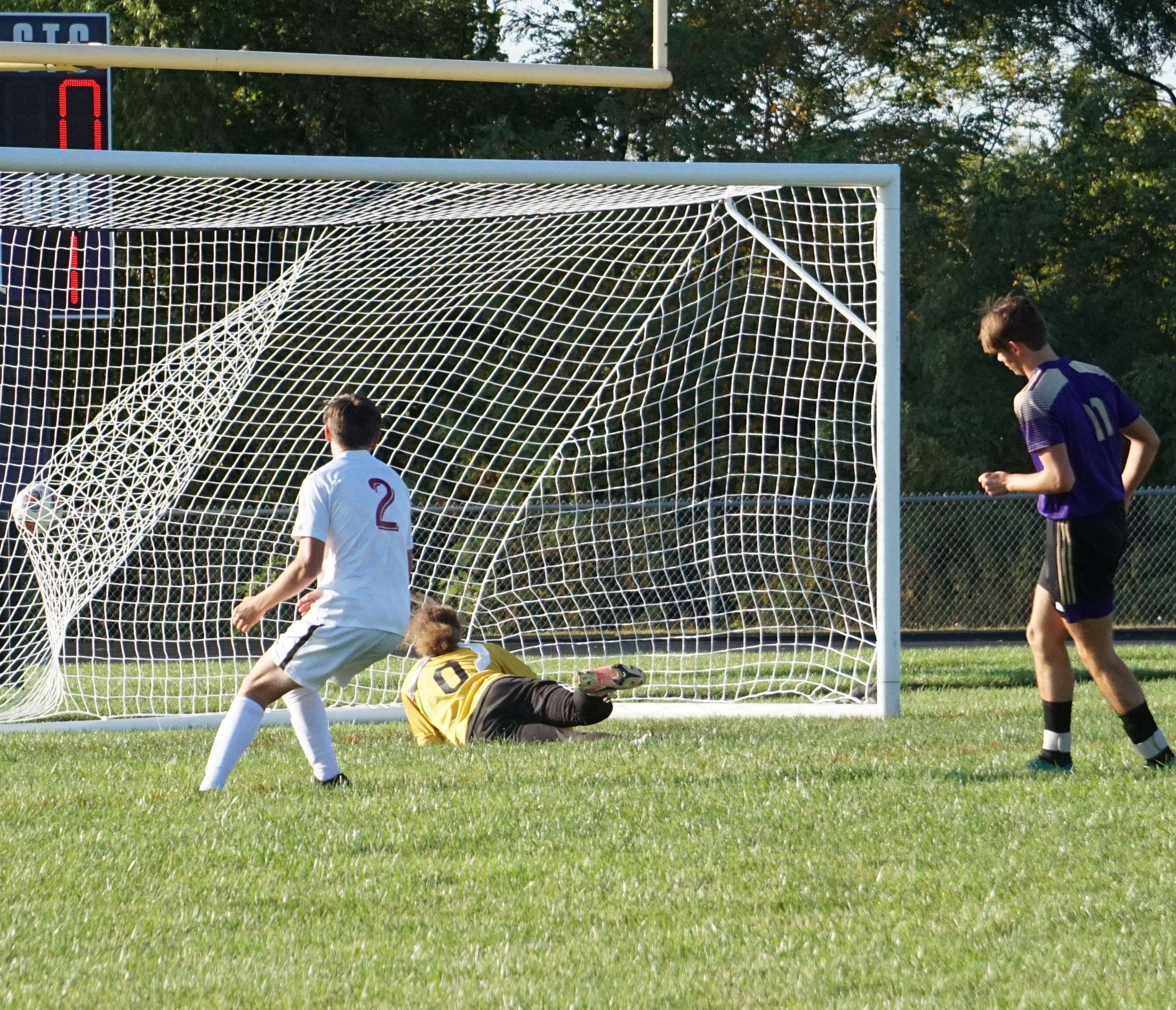 Noah Stevenson (right) puts a ball in the back of the net in the first half.