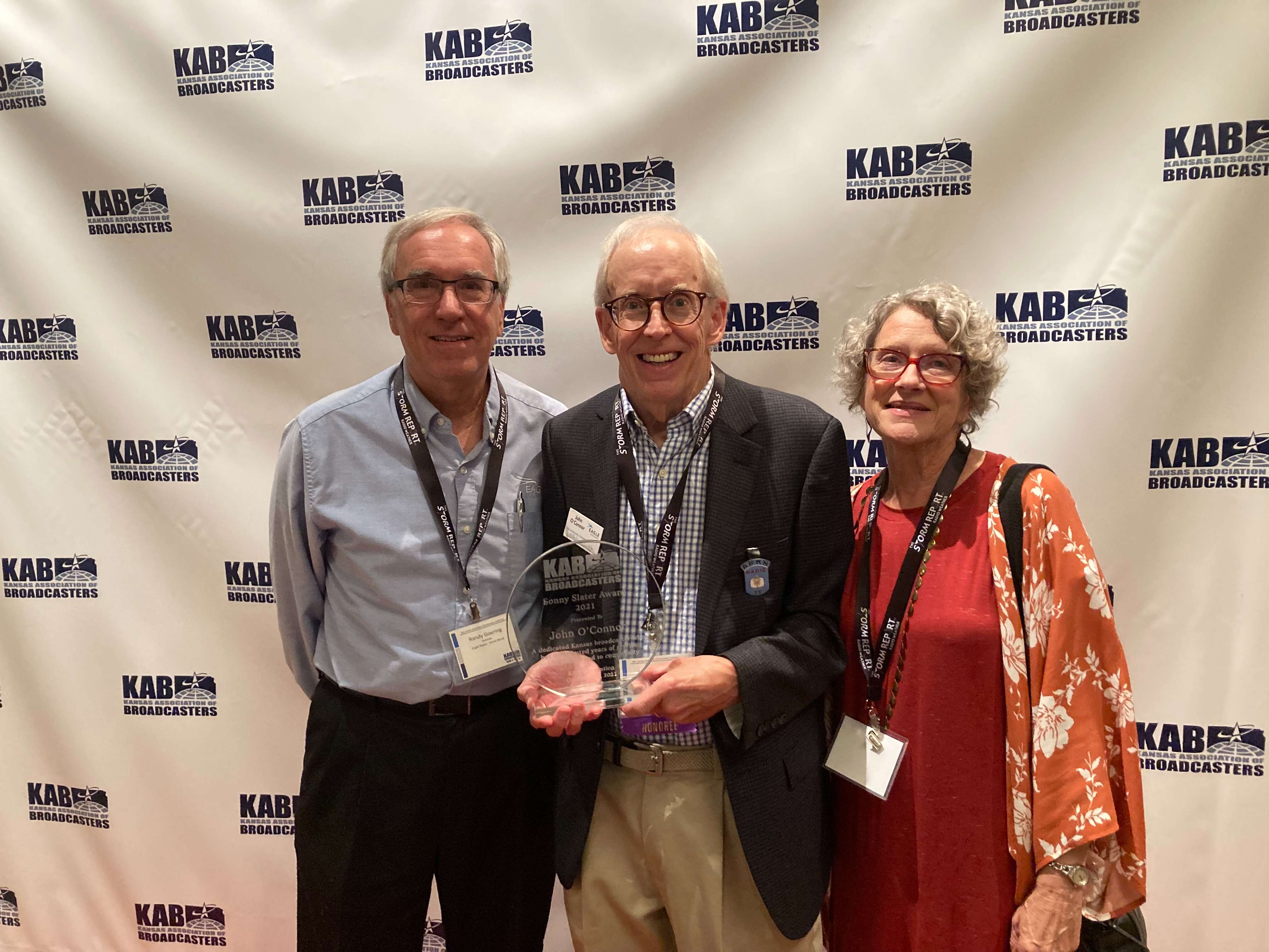 John O'Connor (center) pictured with former Eagle Radio General Manager Randy Goering and wife Sally O'Connor.