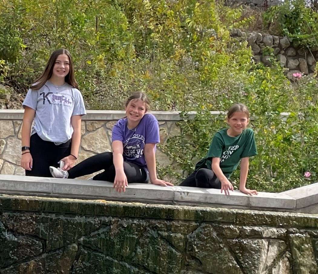 Grace Schmeidler, Faith Schmeidler, and Lexi Casey of Buckeye Jr. Farmers 4‐H Club recently helped with cleanup at Rock Springs Ranch. Submitted photo