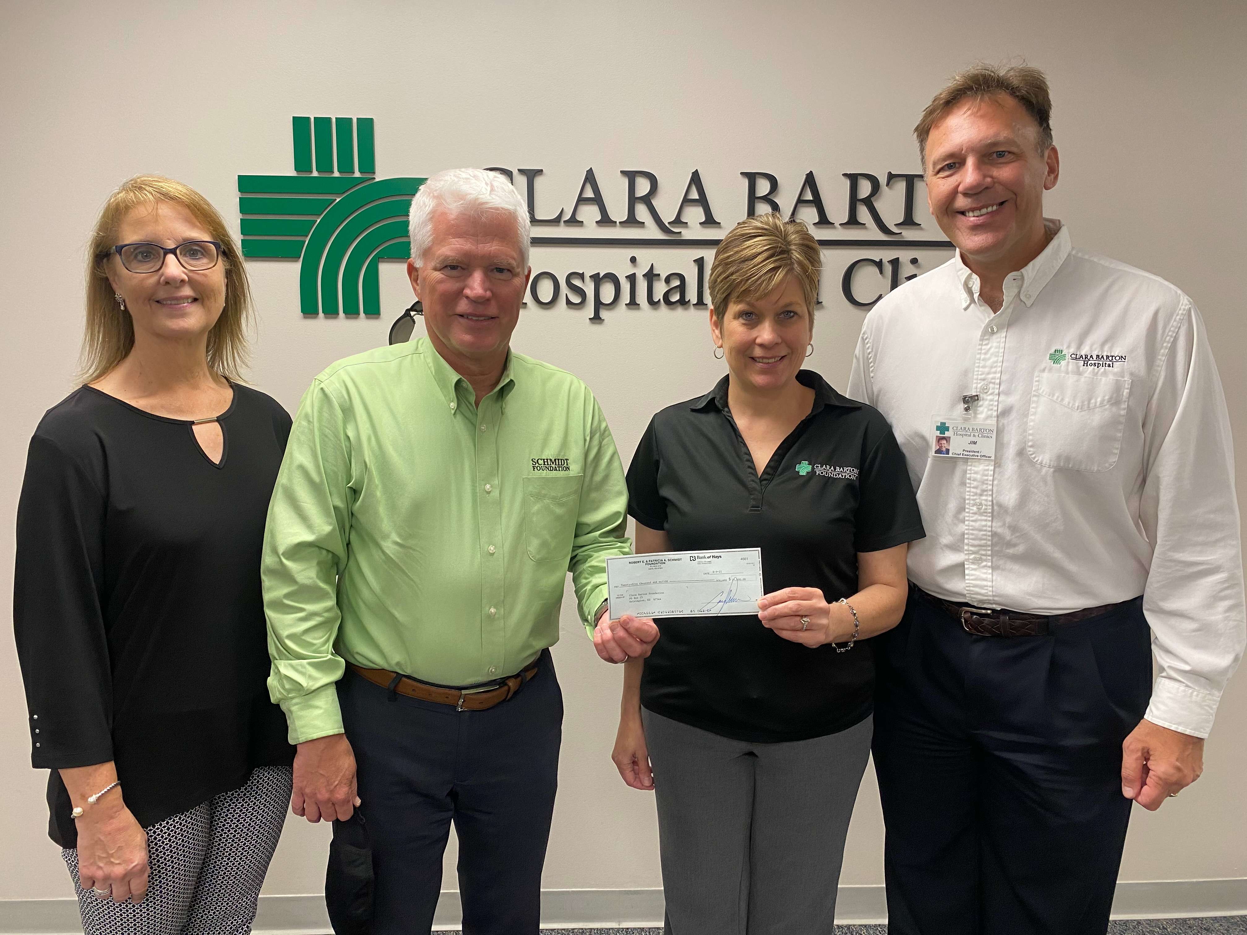 On behalf of the Schmidt Foundation, Gary Shorman, Foundation President, presents a $25,000 check to the Clara Barton Hospital Foundation in support of the outdoor pergola and seating area that will soon be constructed alongside the new walking trail at the new Clara Barton Clinic location in Great Bend. (pictured left to right: Karla Crissman, Gary Shorman, Michelle Moshier, Jim Blackwell)