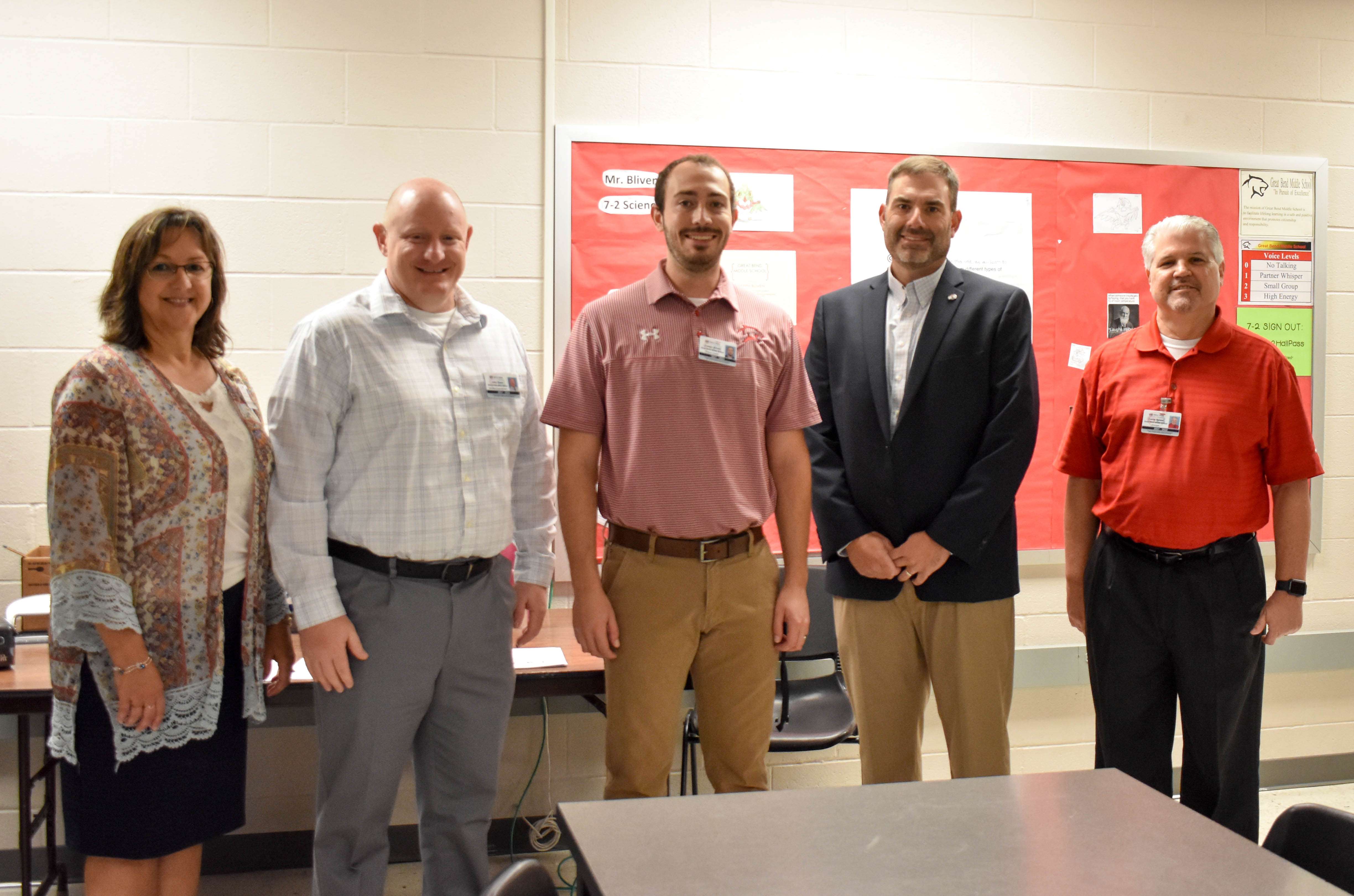 Joseph Bliven, science teacher at Great Bend Middle School was named the 2022 USD 428 Secondary Teacher of the Year. Pictured left to right: Tricia Reiser, director of teaching and learning; John Popp, assistant superintendent; Joseph Bliven; Khris Thexton, superintendent and David Reiser, principal of GBMS.
