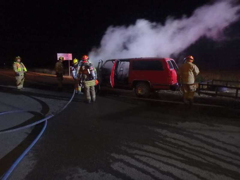 <b>Firefighter from Rural Fire District No. 7 work to extinguish the burning Suburban.</b> Photo courtesy Saline County Sheriff's Office