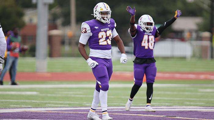 <b>Coyote football's Chris Scott, foreground.</b> Photo courtesy <a href="http://kwucoyotes.com">kwucoyotes.com</a>