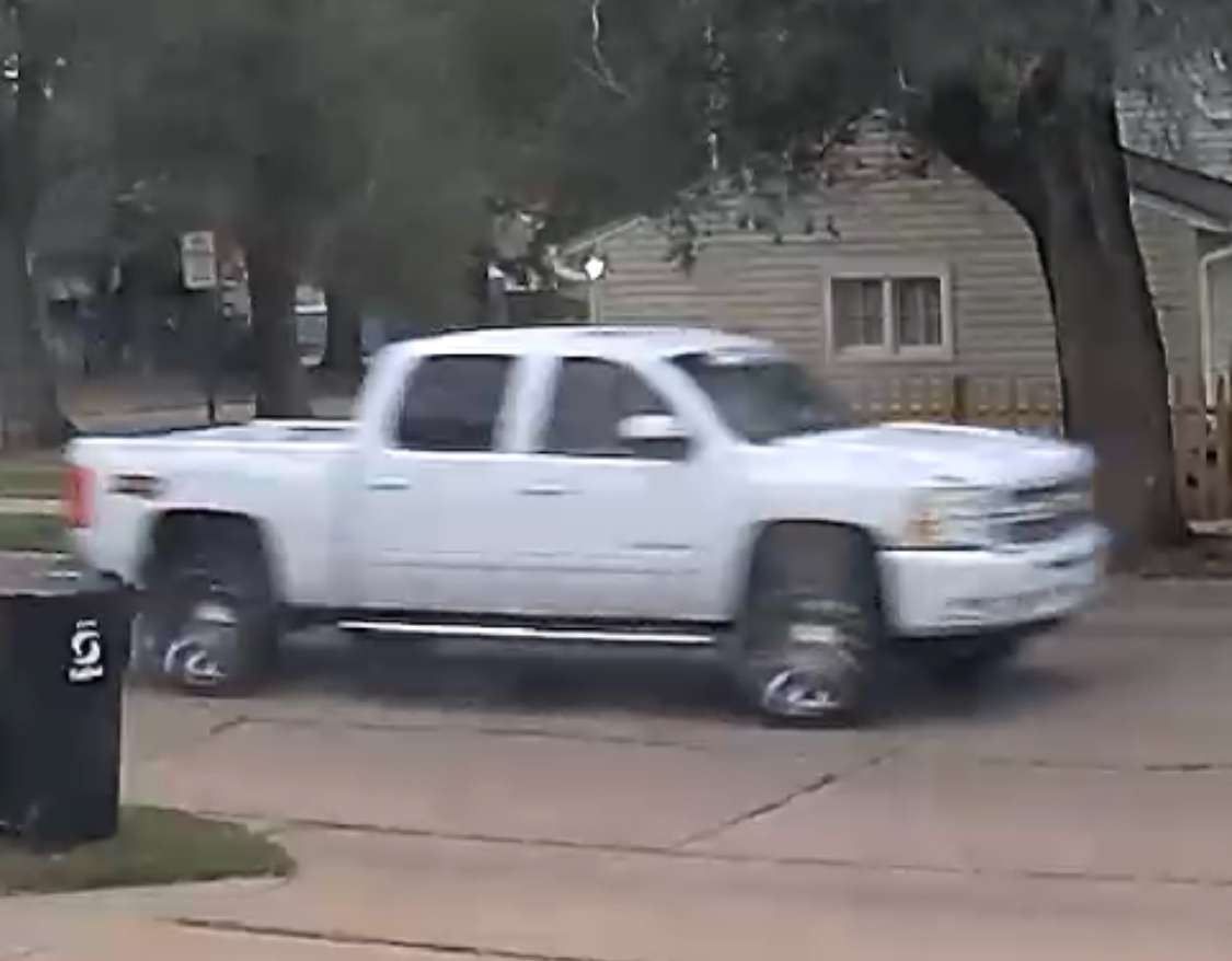 <b>A still image of the white pickup sought in the hit-and-run pulled from surveillance video.</b> Photos courtesy Salina Police Department