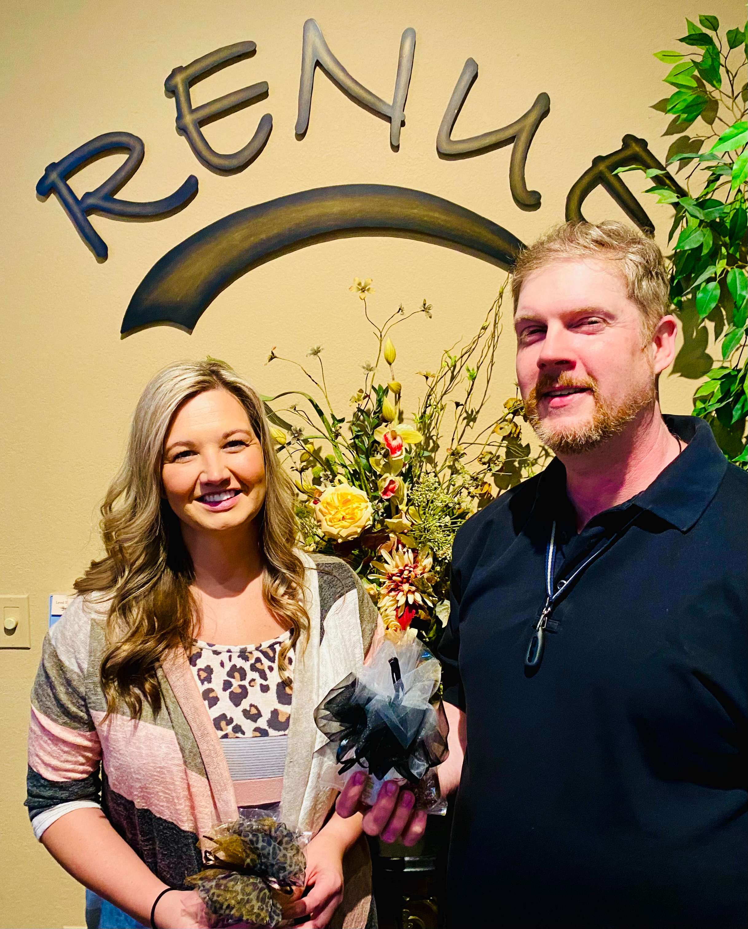 Ashley Fugitt and Jason Eades receive gifts in observance of American Massage Therapy Week. Both therapists care for clients at Renue Salon, Spa and Fashion Boutique in Great Bend.