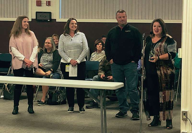 Donna Hudson-Hamilton, Early Childhood Connections director, presents the&nbsp; Kansas Head Start Association 2021 Excellence in Community Service Award to Pastor Micah Sanderson of CrossPoint Church at la recent Hays school board meeting.<br>