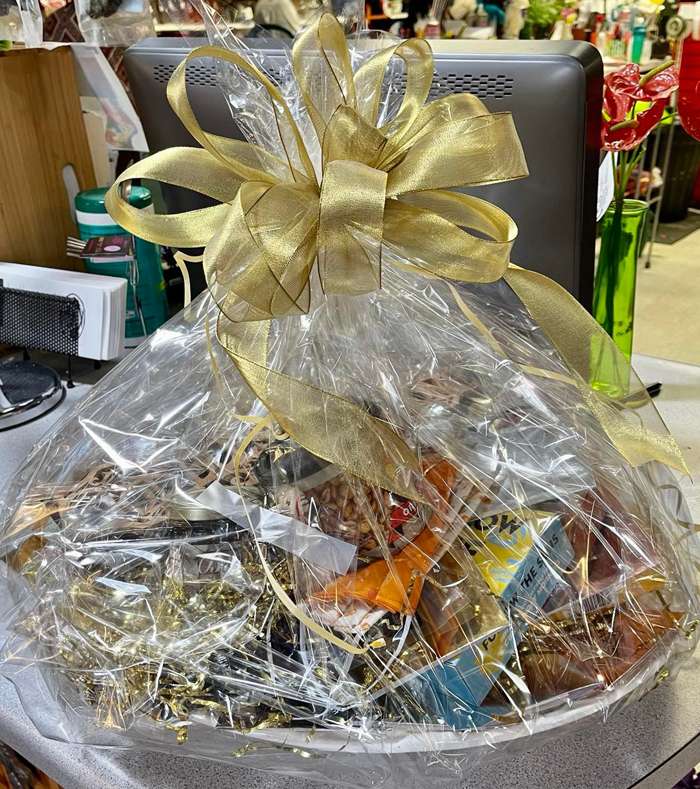 <b>The Flower Nook is planning a Holiday Open House drawing for this gift basket, a more than $200 value, that includes a ready-to-bake turkey donated from Good Shepard Conservancy. </b>Photo courtesy The Flower Nook